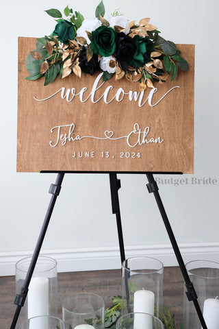 Wedding Sign Flowers that easily accent flowers to attach to a standing easle wedding sign to be used at ceremony or reception in green, black and gold
