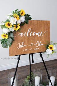 Wedding Sign Flowers that easily accent flowers to attach to a standing easle wedding sign to be used at ceremony or reception in sunflowers and white roses