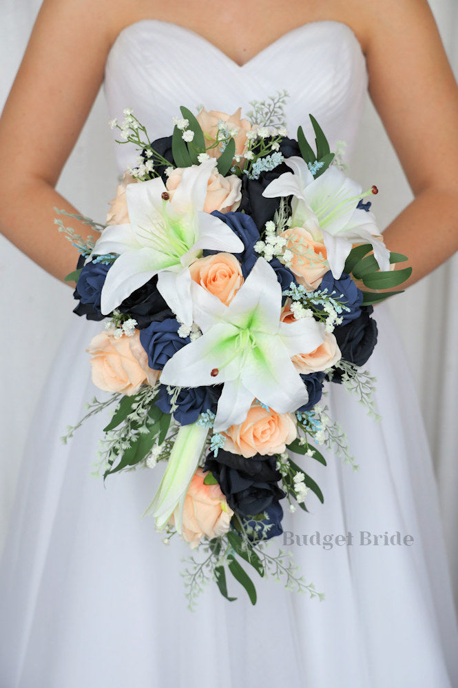 brides bouquet with navy blue, dusty navy and peach roses with Casablanca tiger lilies and babies breath