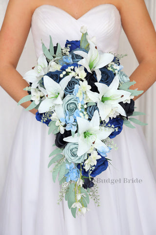 Brides Bouquet with white tiger lilies, dusty blue, ink blue, steel blue and navy blue roses with light blue hydrangea and sage greenery