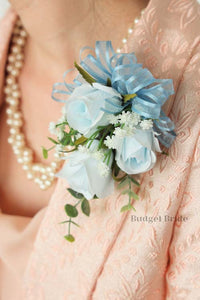 Baby blue rose corsage with dusty blue ribbon