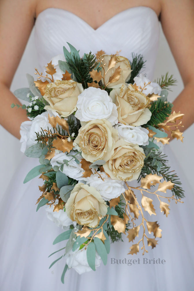 Wedding Flower Brides bouquet with gold glitter tipped roses, white roses, pine greenery and gold leaves, sage greenry and babies breath